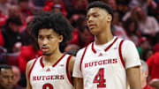 Mar 9, 2025; Piscataway, New Jersey, USA; Rutgers Scarlet Knights guard Dylan Harper (2) and Rutgers Scarlet Knights guard Ace Bailey (4) during a time out during the second half against the Minnesota Golden Gophers at Jersey Mike's Arena. Mandatory Credit: Vincent Carchietta-Imagn Images