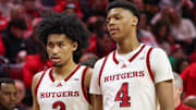 Mar 9, 2025; Piscataway, New Jersey, USA; Rutgers Scarlet Knights guard Dylan Harper (2) and Rutgers Scarlet Knights guard Ace Bailey (4) during a time out during the second half against the Minnesota Golden Gophers at Jersey Mike's Arena. Mandatory Credit: Vincent Carchietta-Imagn Images