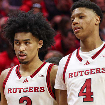 Mar 9, 2025; Piscataway, New Jersey, USA; Rutgers Scarlet Knights guard Dylan Harper (2) and Rutgers Scarlet Knights guard Ace Bailey (4) during a time out during the second half against the Minnesota Golden Gophers at Jersey Mike's Arena. Mandatory Credit: Vincent Carchietta-Imagn Images