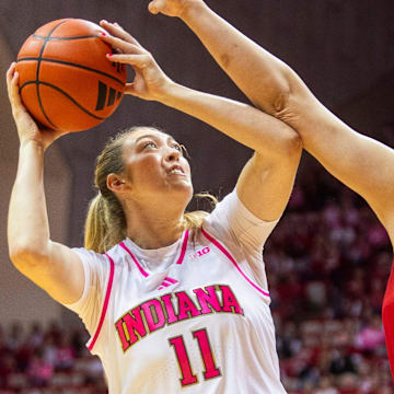 Indiana's Karoline Striplin shoots over Nebraska's Alexis Markowski during Sunday's game in Bloomington.