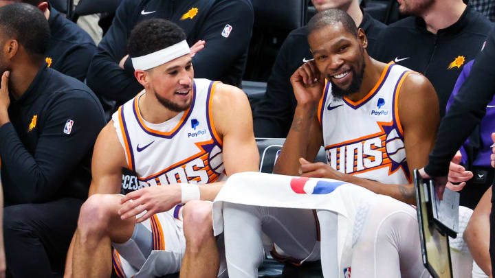 Jan 24, 2024; Dallas, Texas, USA;  Phoenix Suns guard Devin Booker (1) and Phoenix Suns forward Kevin Durant (35) laugh during the fourth quarter against the Dallas Mavericks at American Airlines Center. Mandatory Credit: Kevin Jairaj-USA TODAY Sports