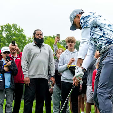 Stephen Curry hits the ball back on to the green on hole No. 7 during the Workday Golden Bear Pro-Am at the Muirfield Village Golf Club on Wednesday, May 28, 2025 in Dublin, Ohio. Curry hit the ball into the spectator’s area but did the ball did not hit anyone.