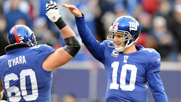 58074 Bergen, East Rutherford 11/22/2009 GIANTS STADIUM Giants Eli Manning gets a high five from Shaun O'Hara after a second half Madison Hedgecock touchdown during Sunday's defeat of the Atlanta Falcons 34-31 at Giants Stadium. TYSON TRISH/STAFF PHOTOGRAPHER