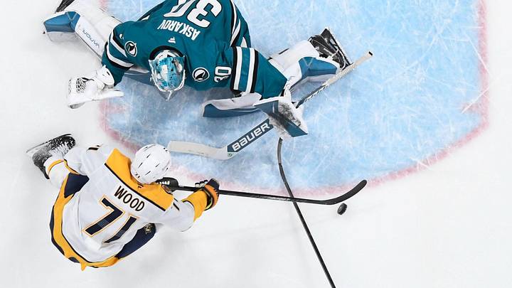 Apr 4, 2026; San Jose, California, USA; San Jose Sharks goaltender Yaroslav Askarov blocks a shot by Nashville Predators right winger Matthew Wood at SAP Center at San Jose.