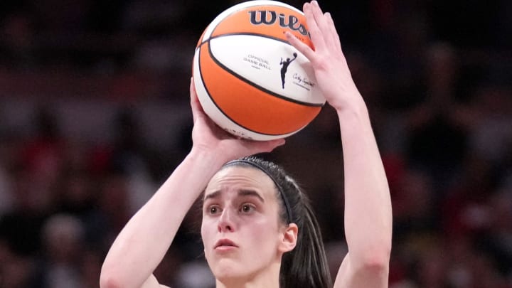 Indiana Fever guard Caitlin Clark (22) shoots and scores a three-point field goal during the second half of a game against the Seattle Storm on Sunday, Aug. 18, 2024, at Gainbridge Fieldhouse in Indianapolis. The Fever defeated the Storm 92-75.