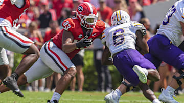 Sep 7, 2024; Athens, Georgia, USA; Georgia Bulldogs defensive lineman Tyrion Ingram-Dawkins (93) tackles Tennessee Tech Golden Eagles wide receiver D'Arious Reed (6) during the first half at Sanford Stadium. Mandatory Credit: Dale Zanine-Imagn Images