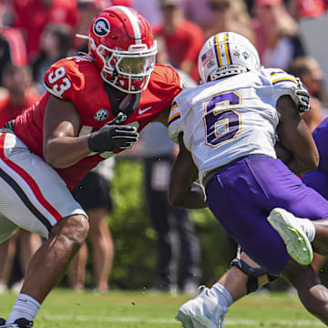 Sep 7, 2024; Athens, Georgia, USA; Georgia Bulldogs defensive lineman Tyrion Ingram-Dawkins (93) tackles Tennessee Tech Golden Eagles wide receiver D'Arious Reed (6) during the first half at Sanford Stadium. Mandatory Credit: Dale Zanine-Imagn Images