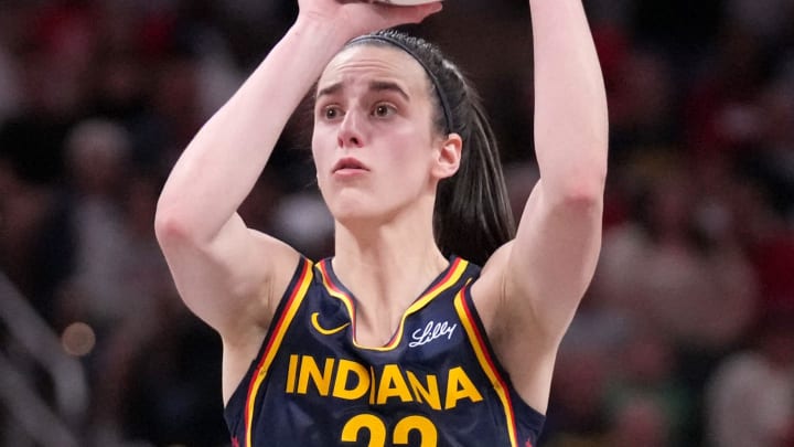 Indiana Fever guard Caitlin Clark (22) shoots and scores a three-point field goal during the second half of a game against the Seattle Storm on Sunday, Aug. 18, 2024, at Gainbridge Fieldhouse in Indianapolis. The Fever defeated the Storm 92-75.