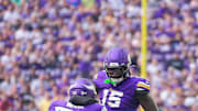Aug 10, 2024; Minneapolis, Minnesota, USA; Minnesota Vikings linebacker Dallas Turner (15) celebrates his sack with linebacker Jihad Ward (52) against the Las Vegas Raiders in the first quarter at U.S. Bank Stadium. Mandatory Credit: Brad Rempel-Imagn Images