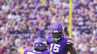 Aug 10, 2024; Minneapolis, Minnesota, USA; Minnesota Vikings linebacker Dallas Turner (15) celebrates his sack with linebacker Jihad Ward (52) against the Las Vegas Raiders in the first quarter at U.S. Bank Stadium. Mandatory Credit: Brad Rempel-Imagn Images