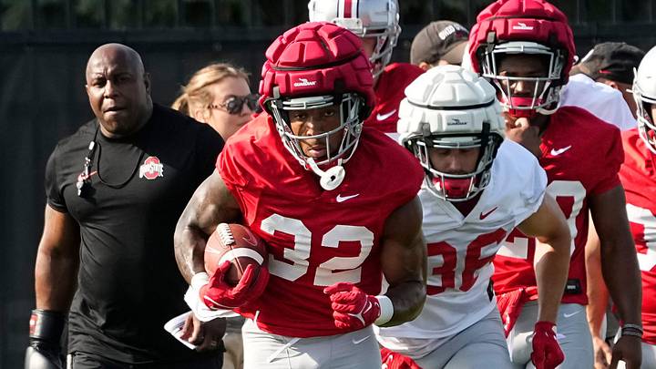 Aug 1, 2024; Columbus, OH, USA; Ohio State Buckeyes running back TreVeyon Henderson (32) runs with the ball during football camp at the Woody Hayes Athletic Complex.