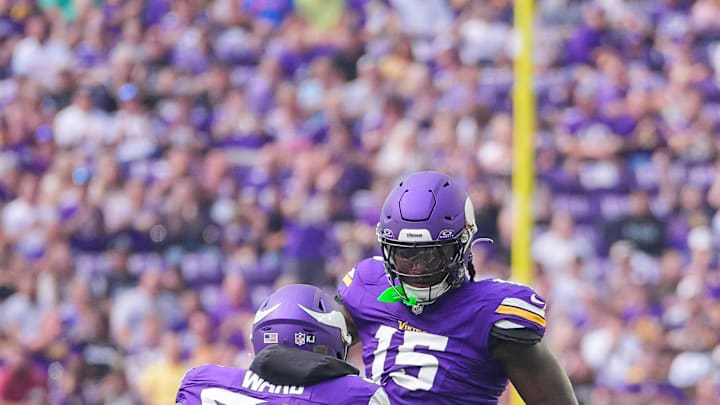 Aug 10, 2024; Minneapolis, Minnesota, USA; Minnesota Vikings linebacker Dallas Turner (15) celebrates his sack with linebacker Jihad Ward (52) against the Las Vegas Raiders in the first quarter at U.S. Bank Stadium. Mandatory Credit: Brad Rempel-Imagn Images