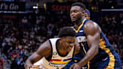 Dec 28, 2022; New Orleans, Louisiana, USA; Minnesota Timberwolves guard Anthony Edwards (1) dribbles against New Orleans Pelicans forward Zion Williamson (1) during the second half at Smoothie King Center. Mandatory Credit: Stephen Lew-Imagn Images