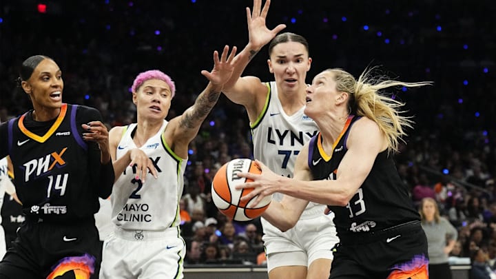 Phoenix Mercury guard Sami Whitcomb (33) drives to the basket against Minnesota Lynx forward Maria Kliundikova (77) in the first half during Game 3 of WNBA semifinals at PHX Arena on Sept. 26, 2025.