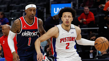 Dec 8, 2021; Detroit, Michigan, USA;  Detroit Pistons guard Cade Cunningham (2) dribbles on Washington Wizards guard Kentavious Caldwell-Pope (1) at Little Caesars Arena. Mandatory Credit: Rick Osentoski-Imagn Images