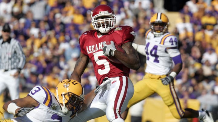 LSU Tigers safety (3) Chad Jones tackles Arkansas Razorbacks running back (5) Darren McFadden during first half action at Tiger Stadium in Baton Rouge.