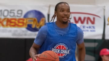 Former Kansas guard Devonte' Graham dribbles down court during the charity game at Thursday's Rock Chalk Roundball Classic at Lawrence Free State High School.