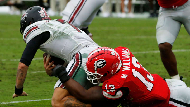 Georgia defensive lineman Mykel Williams (13) sacks South Carolina quarterback Spencer Rattler (7) during the second half of a NCAA college football game against South Carolina in Athens, Ga., on Saturday, Sept. 16, 2023. Georgia won 24-14.