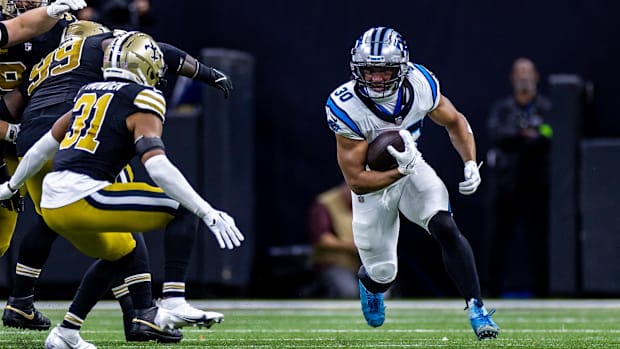 Carolina Panthers running back Chuba Hubbard (30) rushes against New Orleans Saints safety Jordan Howden (31) 