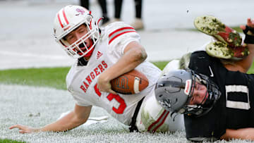 South Side's Ryan Navarra tackles Fort Cherry's Matt Sieg during Friday's Class 1A WPIAL championship game.