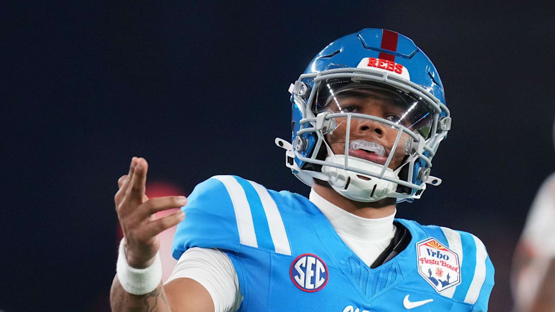 Ole Miss Rebels quarterback Trinidad Chambliss (6) signals a first down after his run against the Miami Hurricanes during their Vrbo Fiesta Bowl matchup at State Farm Stadium on Jan. 8, 2026.