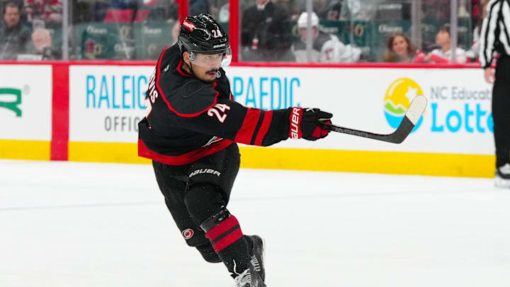 Apr 22, 2025; Raleigh, North Carolina, USA; Carolina Hurricanes center Seth Jarvis (24) takes a shot against the New Jersey Devils during the third period in game two of the first round of the 2025 Stanley Cup Playoffs at Lenovo Center. Mandatory Credit: James Guillory-Imagn Images Apr 22, 2025; Raleigh, North Carolina, USA; Carolina Hurricanes center Seth Jarvis (24) takes a shot against the New Jersey Devils during the third period in game two of the first round of the 2025 Stanley Cup Playoffs at Lenovo Center. Mandatory Credit: James Guillory-Imagn Images