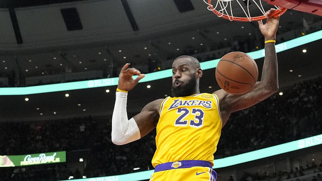 Mar 27, 2025; Chicago, Illinois, USA; Los Angeles Lakers forward LeBron James (23) dunks against the Chicago Bulls during the second half at United Center. Mandatory Credit: David Banks-Imagn Images
