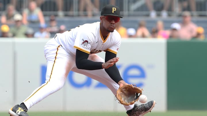 Jul 2, 2025; Pittsburgh, Pennsylvania, USA;  Pittsburgh Pirates third baseman Ke'Bryan Hayes (13) fields a ground ball for an out against St. Louis Cardinals third baseman Thomas Saggese (not pictured) during the sixth inning at PNC Park. Mandatory Credit: Charles LeClaire-Imagn Images