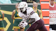 Texas State Bobcats running back Ismail Mahdi (21) goes in for the 10-yard touchdown catch Baylor Bears during the first half at McLane Stadium. 