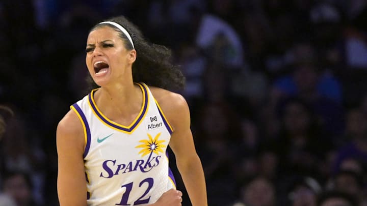 Jul 10, 2025; Los Angeles, California, USA;  Los Angeles Sparks guard Rae Burrell (12) reacts after a basket in the first half against the Minnesota Lynx at Crypto.com Arena. Mandatory Credit: Jayne Kamin-Oncea-Imagn Images