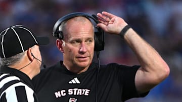 Sep 20, 2025; Durham, North Carolina, USA;  NC State Wolfpack head coach Dave Doeren reacts to a call during the fourth quarter against the Duke Blue Devils at Wallace Wade Stadium. Mandatory Credit: Zachary Taft-Imagn Images