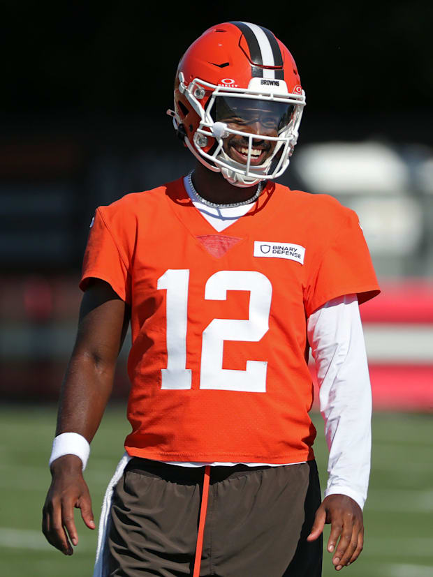 Cleveland Browns quarterback Shedeur Sanders (12) shares a laugh with quarterback Kenny Pickett (8) during NFL training camp
