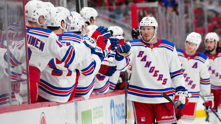 Apr 12, 2025; Raleigh, North Carolina, USA;  New York Rangers left wing J.T. Miller (8) celebrates his goal against the Carolina Hurricanes during the third period at Lenovo Center. Mandatory Credit: James Guillory-Imagn Images