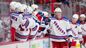 Apr 12, 2025; Raleigh, North Carolina, USA;  New York Rangers left wing J.T. Miller (8) celebrates his goal against the Carolina Hurricanes during the third period at Lenovo Center. Mandatory Credit: James Guillory-Imagn Images