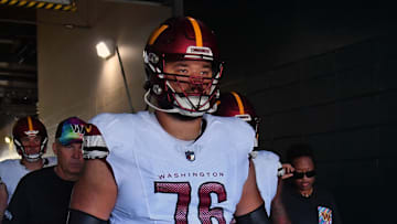 Oct 1, 2023; Philadelphia, Pennsylvania, USA; Washington Commanders offensive tackle Sam Cosmi (76) leads his team in the tunnel against the Philadelphia Eagles at Lincoln Financial Field. Mandatory Credit: Eric Hartline-Imagn Images