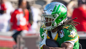 Oregon running back Noah Whittington carries the ball before the game as the Oregon Ducks face the Ohio State Buckeyes on Wednesday, Jan. 1, 2025, in the quarterfinal of the College Football Playoff at the Rose Bowl in Pasadena, Calif.