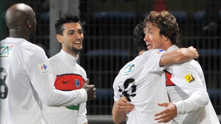 PSG's defender Diego Lugano (R) is congr