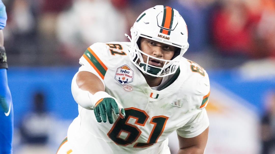 Jan 8, 2026; Glendale, AZ, USA; Miami Hurricanes offensive lineman Francis Mauigoa (61) against the Mississippi Rebels during the 2026 Fiesta Bowl and semifinal game of the College Football Playoff at State Farm Stadium. Mandatory Credit: Mark J. Rebilas-Imagn Images