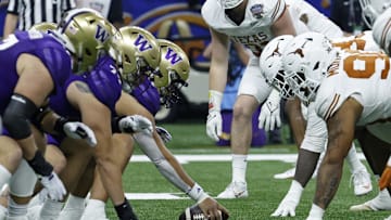 Jan 1, 2024; New Orleans, LA, USA; The Washington Huskies offense lines up against the Texas Longhorns defense in the 2024 Sugar Bowl college football playoff semifinal game at Caesars Superdome. Mandatory Credit: Geoff Burke-Imagn Images