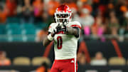 Oct 17, 2025; Miami Gardens, Florida, USA; Louisville Cardinals wide receiver Chris Bell (0) reacts after a carry against the Miami Hurricanes during the second quarter at Hard Rock Stadium. Mandatory Credit: Sam Navarro-Imagn Images