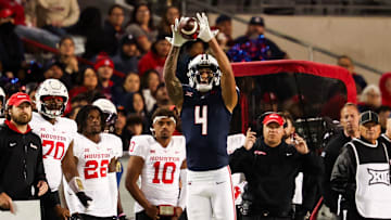 Nov 15, 2024; Tucson, Arizona, USA; Arizona Wildcats wide receiver Tetairoa McMillan (4) catches the ball during the third quarter against the Houston Cougars at Arizona Stadium. Mandatory Credit: Aryanna Frank-Imagn Images