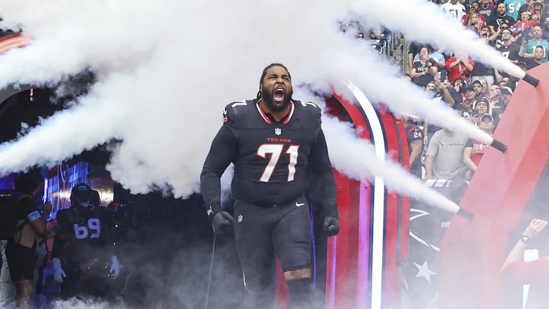 Dec 15, 2024; Houston Texans offensive tackle Tytus Howard (71) runs onto the field before the game against the Miami Dolphins at NRG Stadium. Mandatory Credit: Troy Taormina-Imagn Images