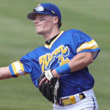 RubberDucks second baseman Travis Bazzana throws to first base to retire an Altoona Curve runner on April 13, 2025, in Akron, Ohio.