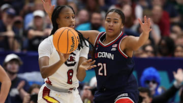 Apr 6, 2025; Tampa, FL, USA; Connecticut Huskies forward Sarah Strong (21) defends against South Carolina Gamecocks forward Joyce Edwards (8) during the first half the national championship of the women's 2025 NCAA tournament at Amalie Arena. Mandatory Credit: Nathan Ray Seebeck-Imagn Images