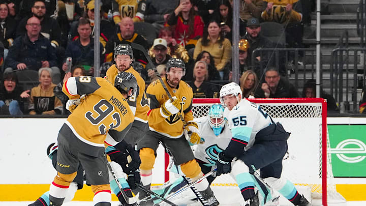 Jan 31, 2026; Las Vegas, Nevada, USA; Vegas Golden Knights right wing Mitch Marner (93) scores on a shot as center Tomas Hertl (48) and right wing Mark Stone (61) screen Seattle Kraken goaltender Joey Daccord (35) during the second period at T-Mobile Arena. Mandatory Credit: Stephen R. Sylvanie-Imagn Images