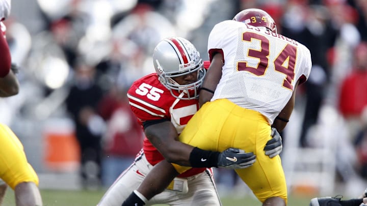 Oct 28, 2006; Columbus, OH, USA; Ohio State Buckeyes linebacker (55) Curtis Terry tackles Minnesota Golden Gophers running back (34) E.J. Jones in the first quarter at Ohio Stadium. Mandatory Credit: Matthew Emmons-Imagn Images © copyright Matthew Emmons