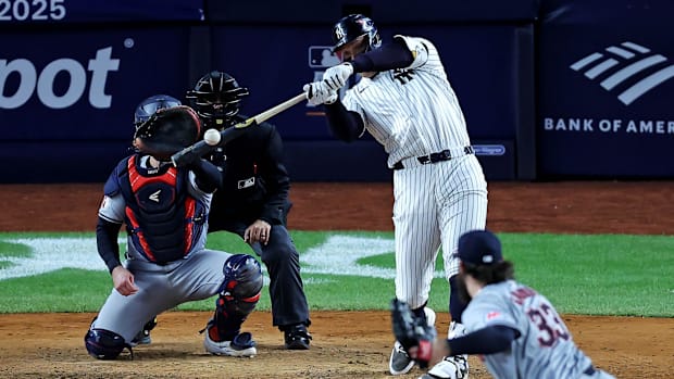 Yankees outfielder Aaron Judge hits a home run in Game 2 of the ALCS.