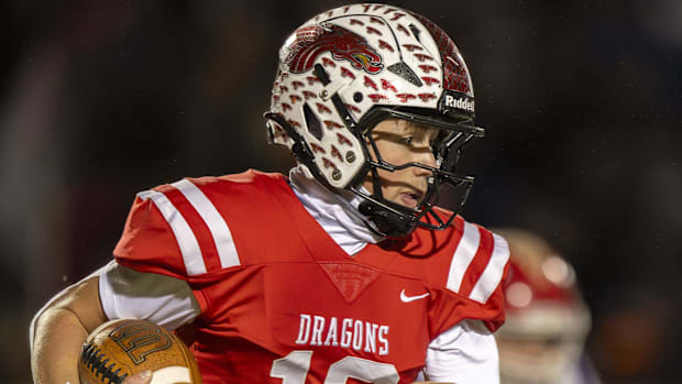 New Palestine QB Jacob Davis runs the ball during the second half of a 2024 IHSAA Semi-State championship football game.
