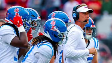 Oct 25, 2025; Norman, Oklahoma, USA;  Ole Miss Rebels head coach Lane Kiffin during a timeout with his players during the second half against the Oklahoma Sooners at Gaylord Family-Oklahoma Memorial Stadium. Mandatory Credit: Kevin Jairaj-Imagn Images