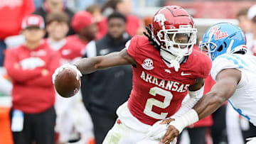 Nov 2, 2024; Fayetteville, Arkansas, USA; Arkansas Razorbackswide receiver Andrew Armstrong (2) runs after a catch in the fourth quarter as Ole Miss Rebels linebacker Tyler Banks (34) defends at Donald W. Reynolds Razorback Stadium. Mississippi won 63-31. Mandatory Credit: Nelson Chenault-Imagn Images